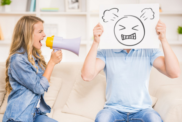 wife-shouting-her-husband-with-mouthpiece_85574-5373.jpg